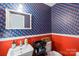 Charming bathroom with patterned wallpaper and pedestal sink at 15016 Rocky River Rd, Davidson, NC 28036