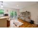 Eat-in kitchen with island and sliding door to backyard patio at 15016 Rocky River Rd, Davidson, NC 28036