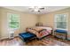 Bedroom with hardwood floors, bed, and pet bed at 15016 Rocky River Rd, Davidson, NC 28036