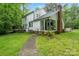Two-story house exterior with deck and brick chimney at 15016 Rocky River Rd, Davidson, NC 28036