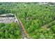 Aerial view of property with wooded surroundings at 15016 Rocky River Rd, Davidson, NC 28036