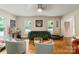 Open living room showcasing hardwood floors, plush seating and natural light at 15016 Rocky River Rd, Davidson, NC 28036