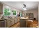 Bright kitchen with butcher block island and granite countertops at 15016 Rocky River Rd, Davidson, NC 28036