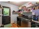 Laundry room with washer, dryer, and built-in shelving at 15016 Rocky River Rd, Davidson, NC 28036