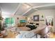 Living room with vaulted ceiling, hardwood floors, and access to backyard at 15016 Rocky River Rd, Davidson, NC 28036