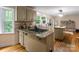 Modern kitchen with granite countertops and gas range at 15016 Rocky River Rd, Davidson, NC 28036