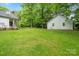 House and detached garage in a large backyard setting at 15016 Rocky River Rd, Davidson, NC 28036