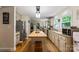 Spacious kitchen with island, stainless steel appliances, and hardwood floors at 15016 Rocky River Rd, Davidson, NC 28036