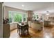 Bright dining area with wood table and kitchen views at 15016 Rocky River Rd, Davidson, NC 28036