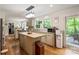 Kitchen boasts an island with butcher block top and ample cabinet space at 15016 Rocky River Rd, Davidson, NC 28036