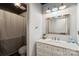 Updated bathroom with white vanity, stylish mirror, and shower/tub combo at 15016 Rocky River Rd, Davidson, NC 28036