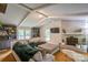 Bright living room with fireplace, built-in shelves and comfortable sectional sofa at 15016 Rocky River Rd, Davidson, NC 28036