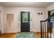 Inviting entryway with hardwood floors and a dark front door at 15016 Rocky River Rd, Davidson, NC 28036
