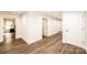 Bright hallway with hardwood floors and access to multiple rooms at 539 N C Ave, Maiden, NC 28650