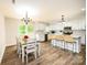 Kitchen and dining area with white cabinets and an island at 539 N C Ave, Maiden, NC 28650