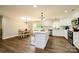 White kitchen with island and stainless steel appliances at 539 N C Ave, Maiden, NC 28650