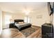 Spacious main bedroom with a king-size bed and hardwood floors at 539 N C Ave, Maiden, NC 28650