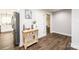 Bright hallway with light wood floors and decorative console table at 539 N C Ave, Maiden, NC 28650
