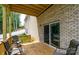 Covered patio with brick wall and sliding glass door access at 539 N C Ave, Maiden, NC 28650