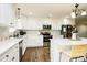 Modern kitchen with white cabinets, stainless steel appliances, and an island at 539 N C Ave, Maiden, NC 28650