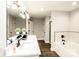 Spa-like bathroom with soaking tub, double vanity, and marble tile at 539 N C Ave, Maiden, NC 28650