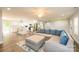 Open concept living room with L-shaped sofa and access to kitchen at 539 N C Ave, Maiden, NC 28650