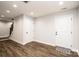 Finished basement with neutral walls, hardwood floors, and ample storage at 539 N C Ave, Maiden, NC 28650