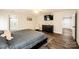 Main bedroom with ceiling fan, large bed, and access to bathroom at 539 N C Ave, Maiden, NC 28650