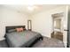 Bright bedroom with grey carpet, ceiling fan and ample space at 539 N C Ave, Maiden, NC 28650