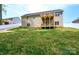 Brick house with a two-tiered deck and a grassy yard at 539 N C Ave, Maiden, NC 28650