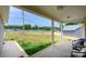 Covered front porch with seating and view of backyard at 539 N C Ave, Maiden, NC 28650