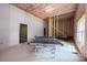 Unfinished basement with ping pong table and window at 539 N C Ave, Maiden, NC 28650
