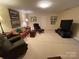 Finished basement with seating area and TV at 500 Muirfield Dr, Albemarle, NC 28001