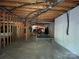 Unfinished basement with ping pong table and potential for recreation at 500 Muirfield Dr, Albemarle, NC 28001