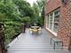 Composite deck with bistro table and chairs, adjacent to the house at 500 Muirfield Dr, Albemarle, NC 28001
