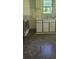 Older kitchen with double sink and white cabinets at 335 Rosenwald School St, Catawba, NC 28609
