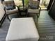 Comfortable seating area in a screened porch at 150 Marina Dr, New London, NC 28127