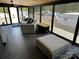 Screened porch with curved sectional and ottoman at 150 Marina Dr, New London, NC 28127