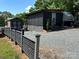 Modern RV lot with screened porch and fenced yard at 150 Marina Dr, New London, NC 28127