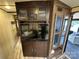 Large TV and entertainment center with ample storage at 150 Marina Dr, New London, NC 28127