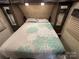 Main bedroom with a queen bed and mirrored closets at 150 Marina Dr, New London, NC 28127