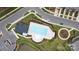Aerial view showing community pool, playground, and parking at 424 Wharton St, Monroe, NC 28110