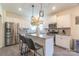 Modern kitchen with white cabinets, granite island, and stainless steel appliances at 424 Wharton St, Monroe, NC 28110