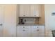 Kitchen features additional counter space and cabinets at 424 Wharton St, Monroe, NC 28110