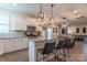 Modern kitchen with white cabinets, granite countertops, and island at 424 Wharton St, Monroe, NC 28110