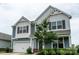 Two-story house with gray siding and white accents at 424 Wharton St, Monroe, NC 28110