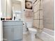 Clean bathroom with a bathtub, shower, and gray vanity at 2325 Rozzelles Ferry Rd # 25, Charlotte, NC 28208