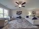 Bright living room featuring hardwood floors, modern furniture, and natural light at 1016 Forest Dr, Marshville, NC 28103