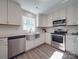 Modern kitchen with white cabinets, stainless steel appliances, and farmhouse sink at 1016 Forest Dr, Marshville, NC 28103