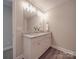 Double vanity bathroom with granite countertops and white cabinets at 1016 Forest Dr, Marshville, NC 28103